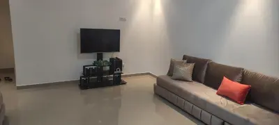 a living room with a couch and a flat screen tv at APPARTEMENT haut standing in O Ben Slimane