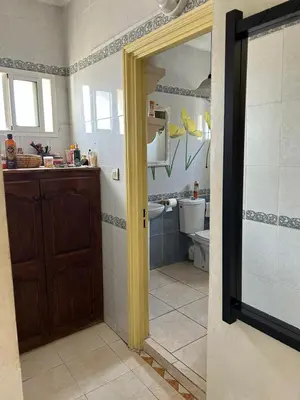 a bathroom with a sink and a toilet at Apparemment déjà vendu ne réserve pas in Azemmour