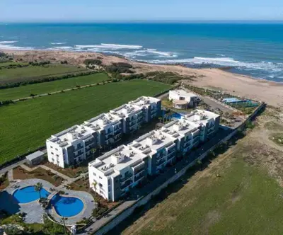 an aerial view of a resort on the beach at Appartement Casablanca in Dar Bouazza