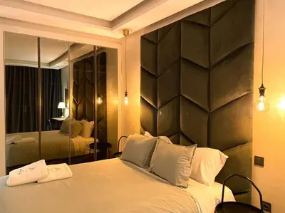 a bedroom with a large bed with a large mirror at Glamorous Habous - By AppartAli in Casablanca