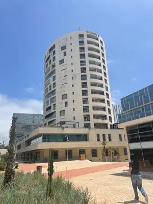 a person standing in front of a tall building at Panoramic View from 14th floor in Casablanca