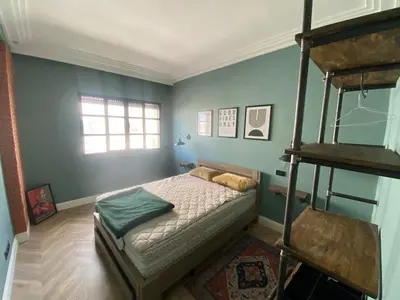 a bedroom with a bunk bed and a ladder at Loft51 in Casablanca