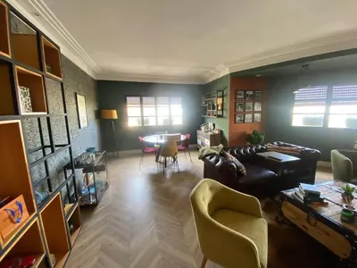 a living room with a couch and chairs and a table at Loft51 in Casablanca