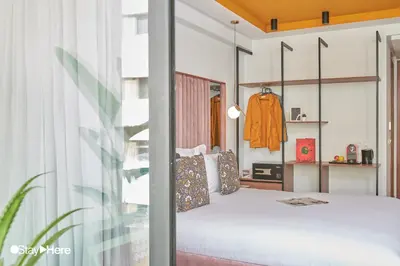 a bedroom with a bed and a window at Stayhere Rabat - Agdal 4 - Hotel in Rabat