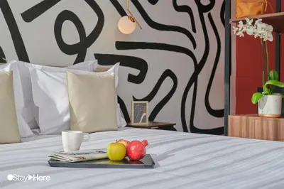 a tray of fruit sitting on top of a bed at Stayhere Rabat - Agdal 4 - Hotel in Rabat
