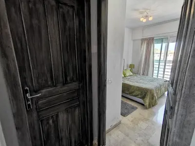 an open door to a bedroom with a bed at Blume Apartment Casa Port - 2 Bedrooms in Casablanca