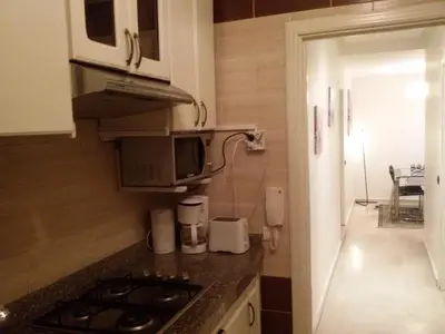 a small kitchen with a stove and a microwave at Stylish Property Perfect for Business & Leisure Trips in Casablanca