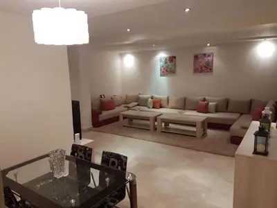 a living room with a couch and a table at Stylish Property Perfect for Business & Leisure Trips in Casablanca