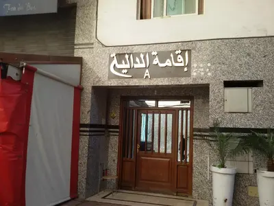 a door to a building with a sign above it at Stylish Property Perfect for Business & Leisure Trips in Casablanca