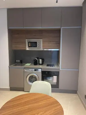 a kitchen with a stove and a washing machine at Magic Appartement Luxury Gauthier 04 in Casablanca