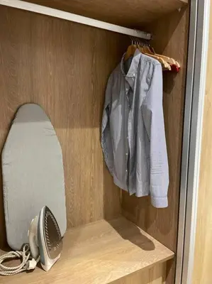 a closet with a hair dryer and a fan at Central Holiday Apartment in Casablanca