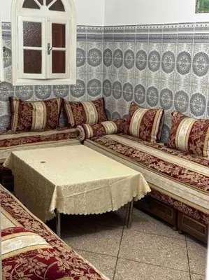 a living room with a couch and a table at Welcome Loc T4 in Casablanca