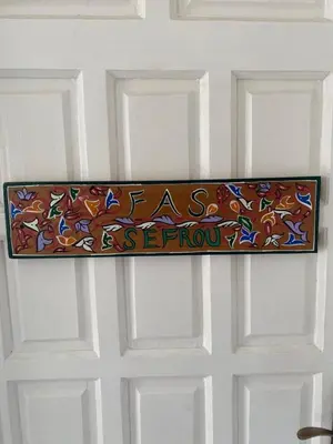 a door with a sign that reads peace is reborn at Villa entière Dar Baida Plage David Bouznika in Bouznika