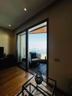 a living room with a view of the ocean at Magnifique appartement pleine vue mer Marina Casablanca in Casablanca