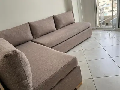 a brown couch sitting in a living room at appartement meublé in Mohammedia