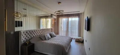 a bedroom with a bed with two pillows on it at Le Bijou du Maarif in Casablanca