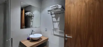 a bathroom with a sink and a mirror at Le Bijou du Maarif in Casablanca
