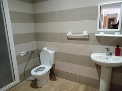 a bathroom with a toilet and a sink at Appart 3p vue sur mer in Rabat