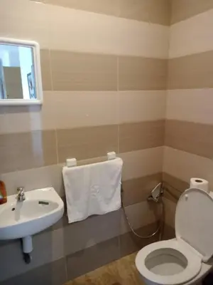 a bathroom with a toilet and a sink at Appart 3p vue sur mer in Rabat