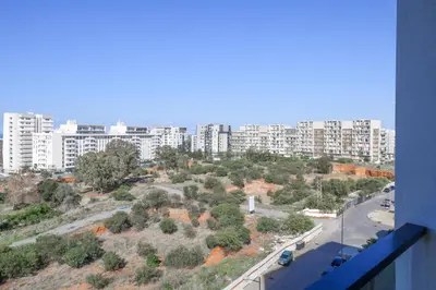 a view of a city with tall buildings at Magnificient Appartment in Prestigia in Rabat