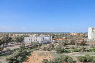 an aerial view of a city with trees and buildings at Magnificient Appartment in Prestigia in Rabat