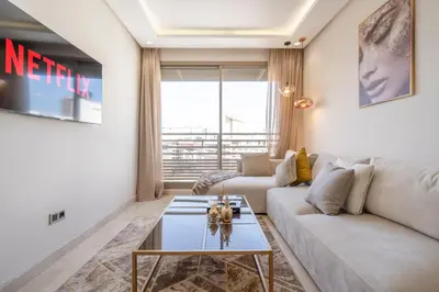 a living room with a couch and a table at Maarif princess amazing one bedroom flat in Casablanca