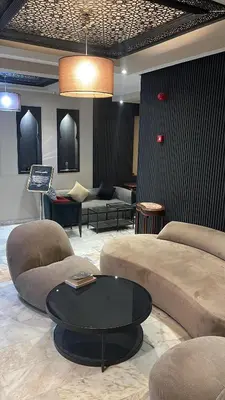 a living room with couches and a coffee table at Cadé Hotel in Casablanca