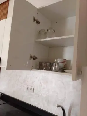 a kitchen with a white counter top and shelves at Studio à Prestigia HayRiad/Rabat in Rabat