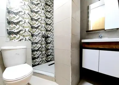 a bathroom with a toilet and a sink at Appart relax aéroport 5 min in Nouaceur