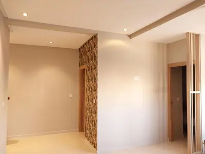 a room with a wall with a patterned wall at Appart relax aéroport 5 min in Nouaceur