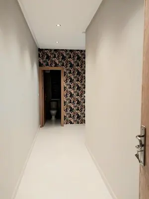an empty corridor with a toilet in a room at Appart relax aéroport 5 min in Nouaceur