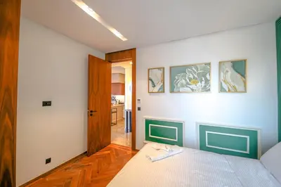 a room with a bed and a room with a door at ROYAL ANFA PARK SUITE-BY AYLA STAY in Casablanca