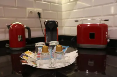 a counter top with a plate with cups on it at AeroSuite in Nouaceur