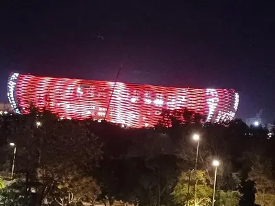 a lit up building with red lights at night at Spacieux et familial à 2 minutes à pied du stade de football de RABAT in Rabat