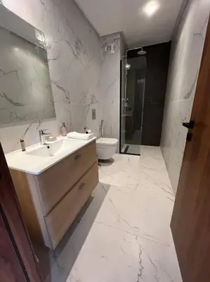 a bathroom with a sink and a toilet at Luxury flat at Casa Finance city in Casablanca