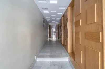 an empty hallway with a long corridor with wooden walls at Charming apartment at Maarif in Casablanca