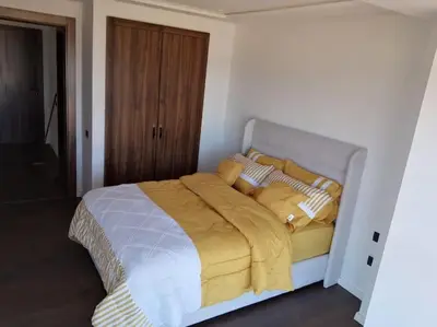 a white bed with a yellow blanket on it at Luxury Villa Jack Beach Resort Ocean Oasis View Panoramic in Casablanca