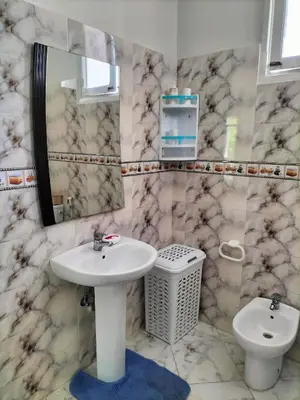 a bathroom with a sink and a toilet at Villa Pierrette Casablanca in Casablanca
