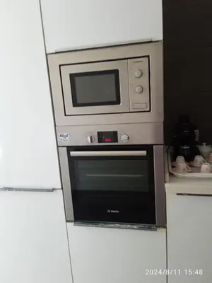a microwave above a oven in a kitchen at Ocean View Apartment - Anfa Place - in Casablanca