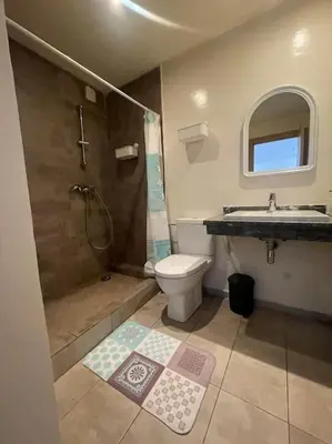 a bathroom with a shower and a toilet and a sink at Studio La gironde in Casablanca