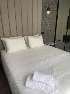 a white bed with two towels on top of it at Magic Appartement Luxury Gauthier 10 in Casablanca