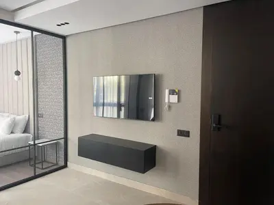 a living room with a tv on the wall at Magic Appartement Luxury Gauthier 10 in Casablanca