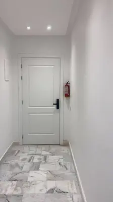 a room with a white door and a tile floor at Luxury apartment fully furnished in Casablanca