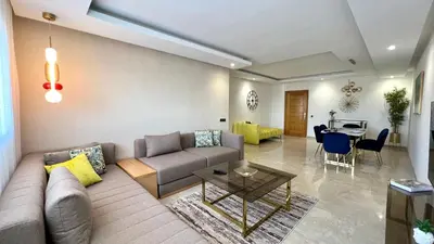 a living room with a couch and a table at The building of Terrazas 34 - By AppartAli in Casablanca