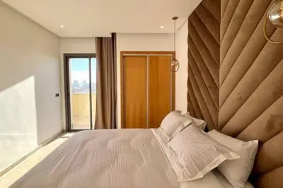 a bedroom with a large bed and a large window at Business Travelers and Families - 3 Bedrooms in Casablanca