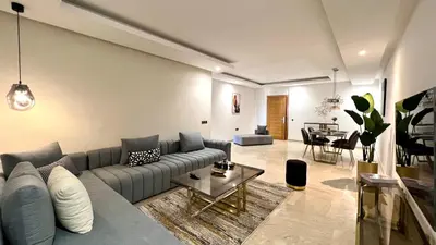 a living room with a couch and a table at Family 3 Bedrooms- By AppartAli in Casablanca