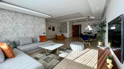 a living room with a couch and a table at Family 3 Bedrooms- By AppartAli in Casablanca