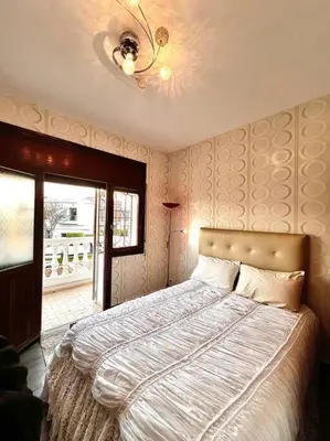 a bedroom with a large bed and a window at Nassali - Luxurious Beachfront Villa with Private Pool in Casablanca