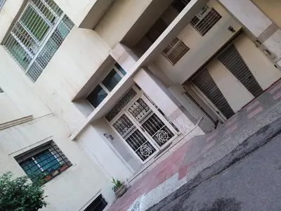 a building with doors and windows on a street at tranquil harmony in Casablanca