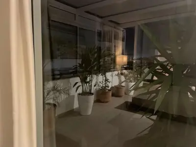 a group of potted plants sitting on a balcony at Central, terrasse, confortable - Bleue résidence in Casablanca